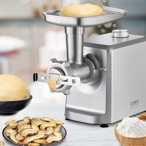 Cookies being made with a food processor processing dough for baking.