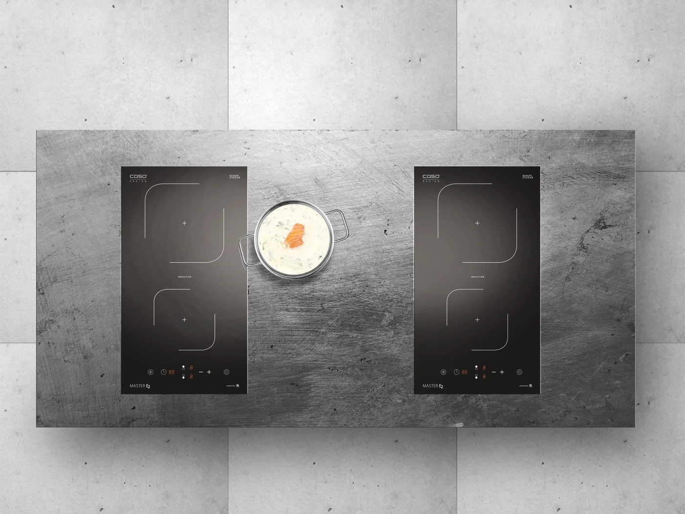 Induction cooktop with pot and food on a gray surface.