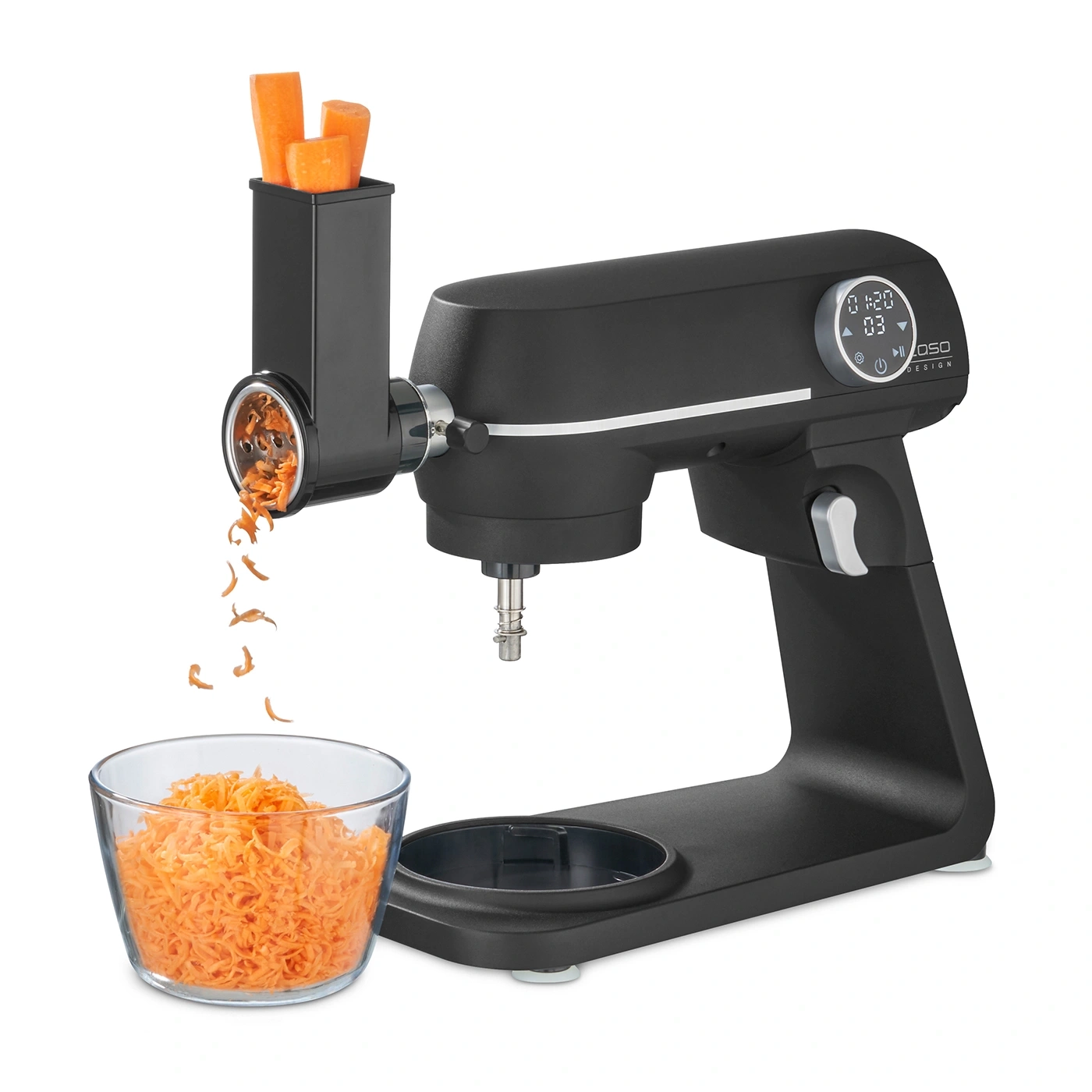 Electric kitchen machine grating carrots into a glass bowl, black design.