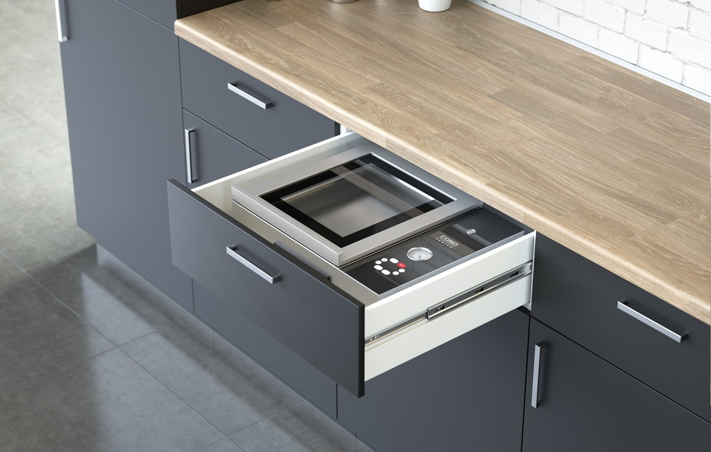 Built-in microwave in a drawer in a modern kitchen with wooden countertop.