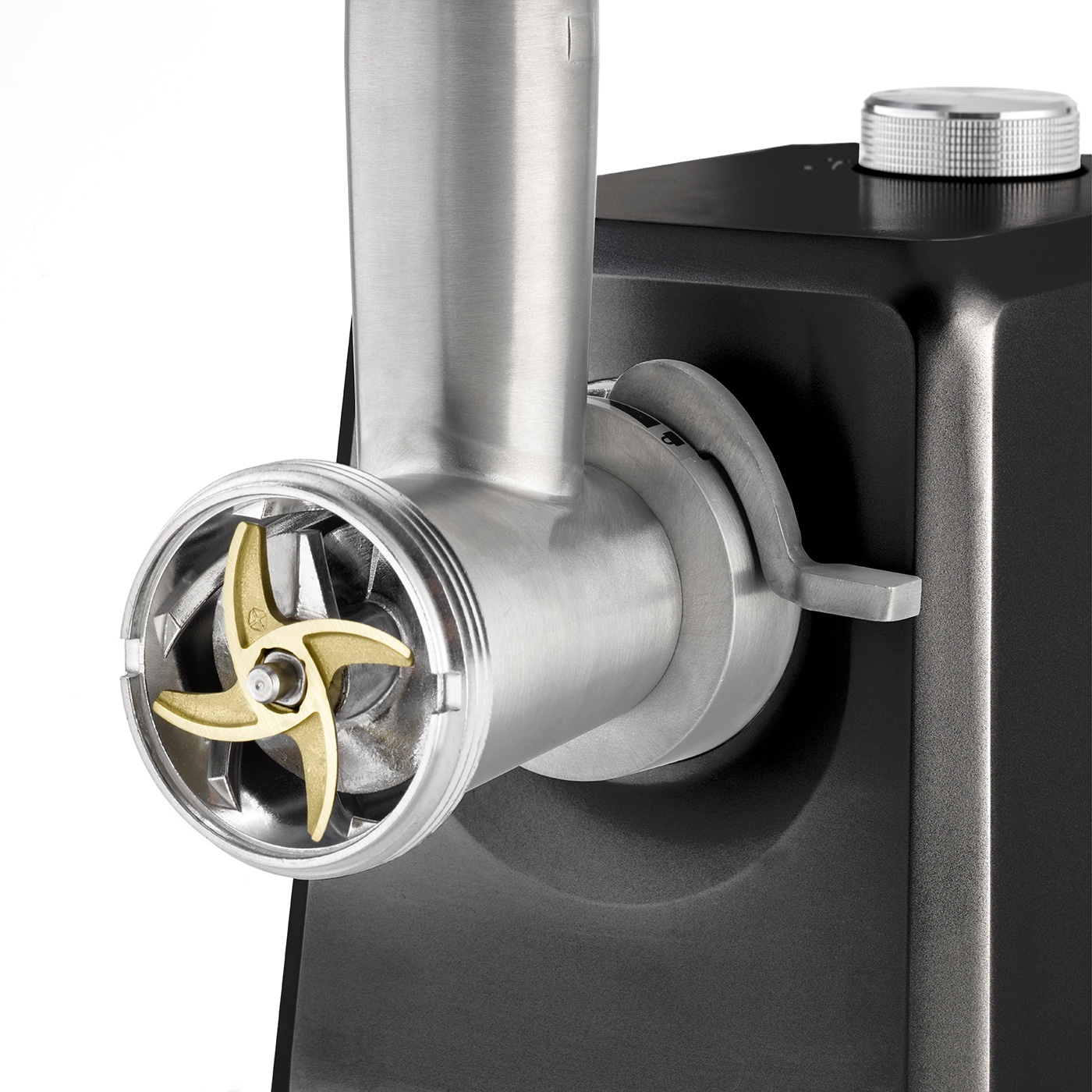 Close-up of a meat grinder machine with golden blade and black housing.