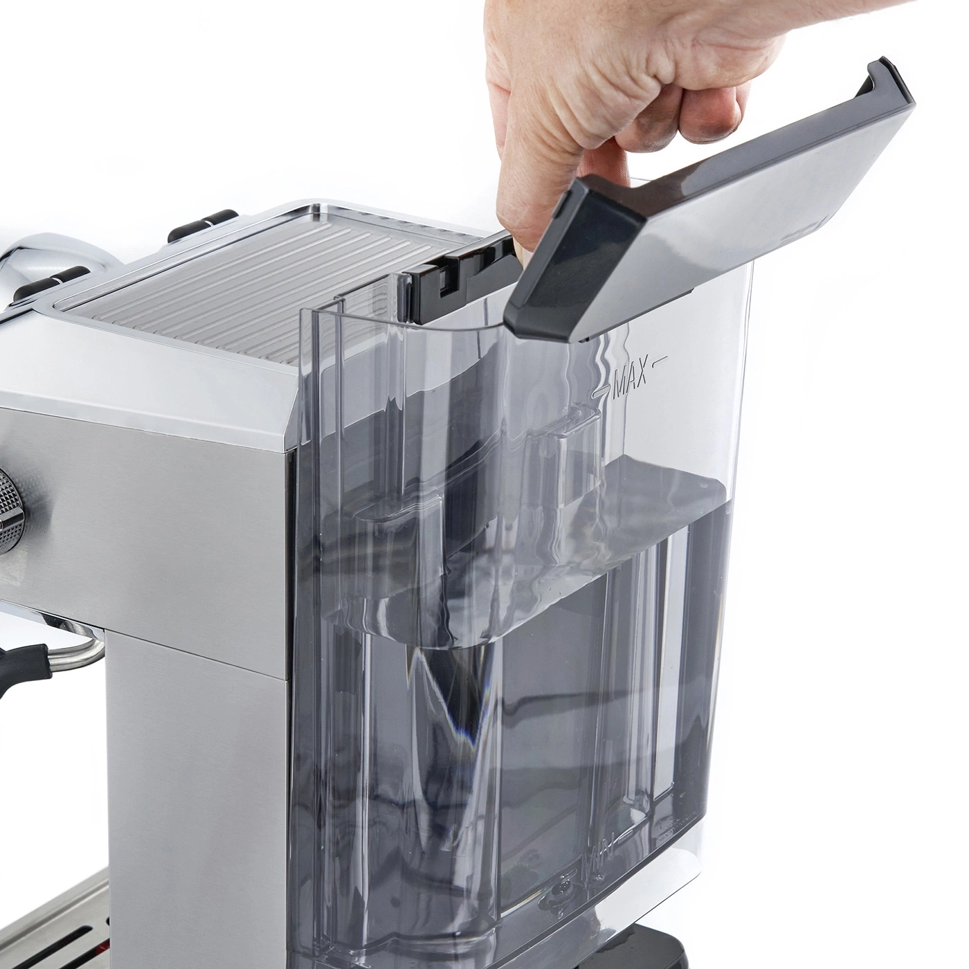 Hand opening coffee machine water tank lid, water visible, close-up, bright