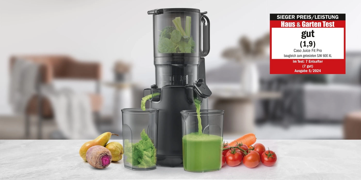 Juicer with vegetables and fruits, rated 'good' by Haus & Garten Test.