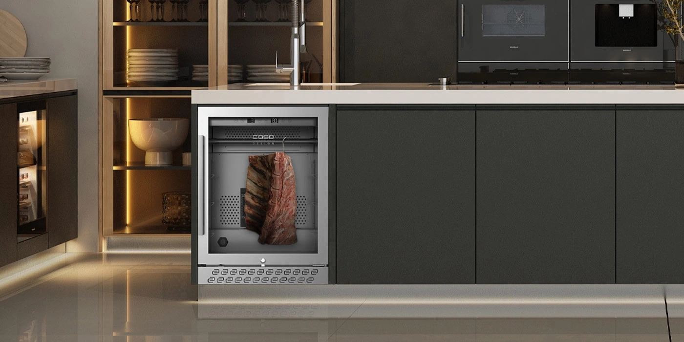 A modern kitchen cabinet with a meat aging fridge and a beverage cooler.