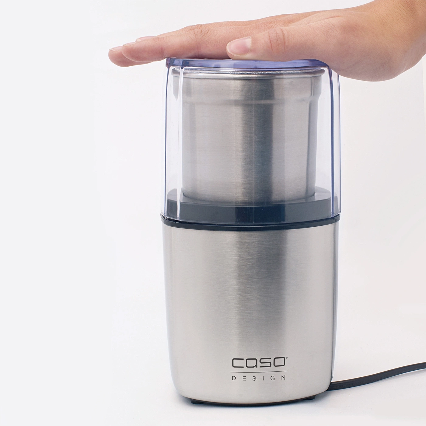 Kaffeemühle mit Hand, Edelstahl, Caso Design, weißer Hintergrund, Nahaufnahme