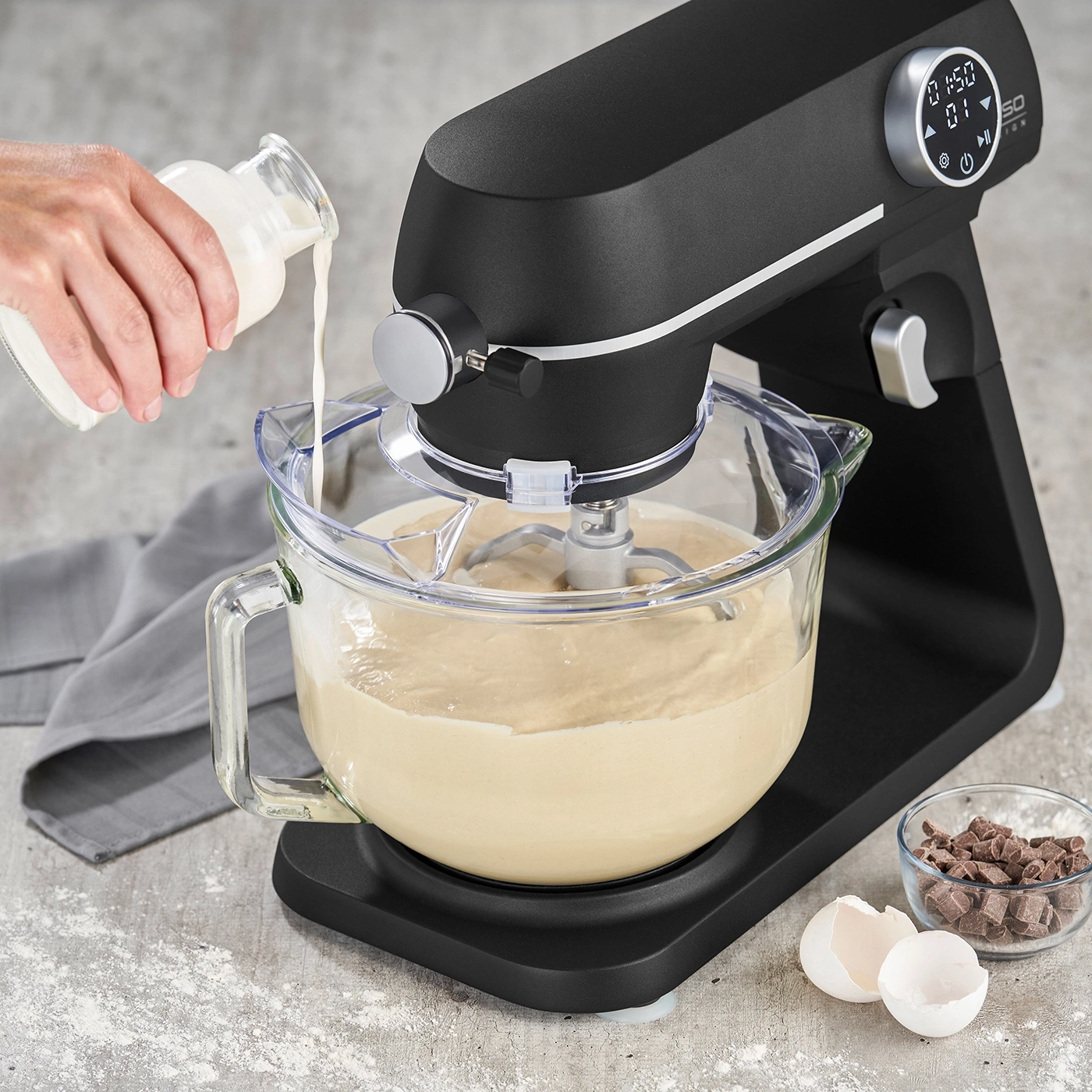 Stand mixer with ingredients, milk being added, baking, kitchen, food preparation