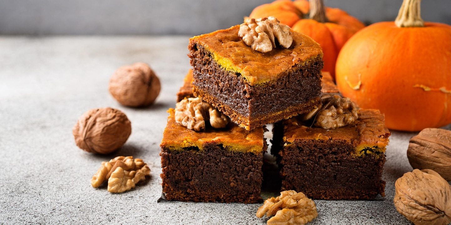 Delicious pumpkin cake with walnuts, autumn dessert, close-up, tasty food