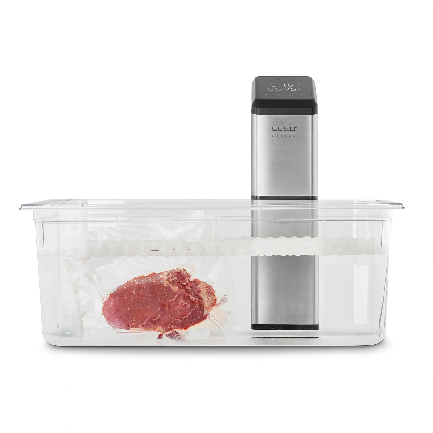 Sous vide machine with meat in water bath. Low temperature cooking.