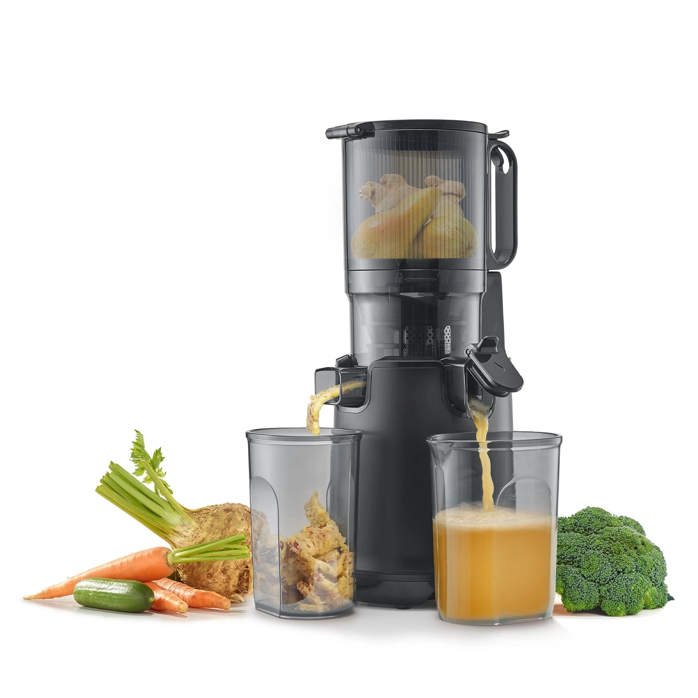 Black juicer with vegetables and juice in glasses, isolated on white background