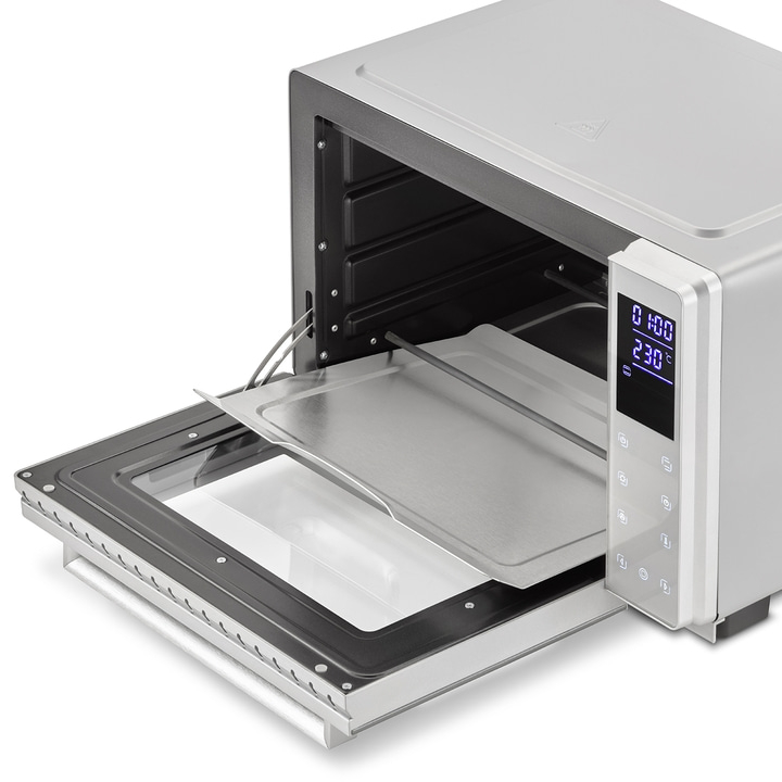 Silver oven with open door and baking tray, digital display showing time and temperature