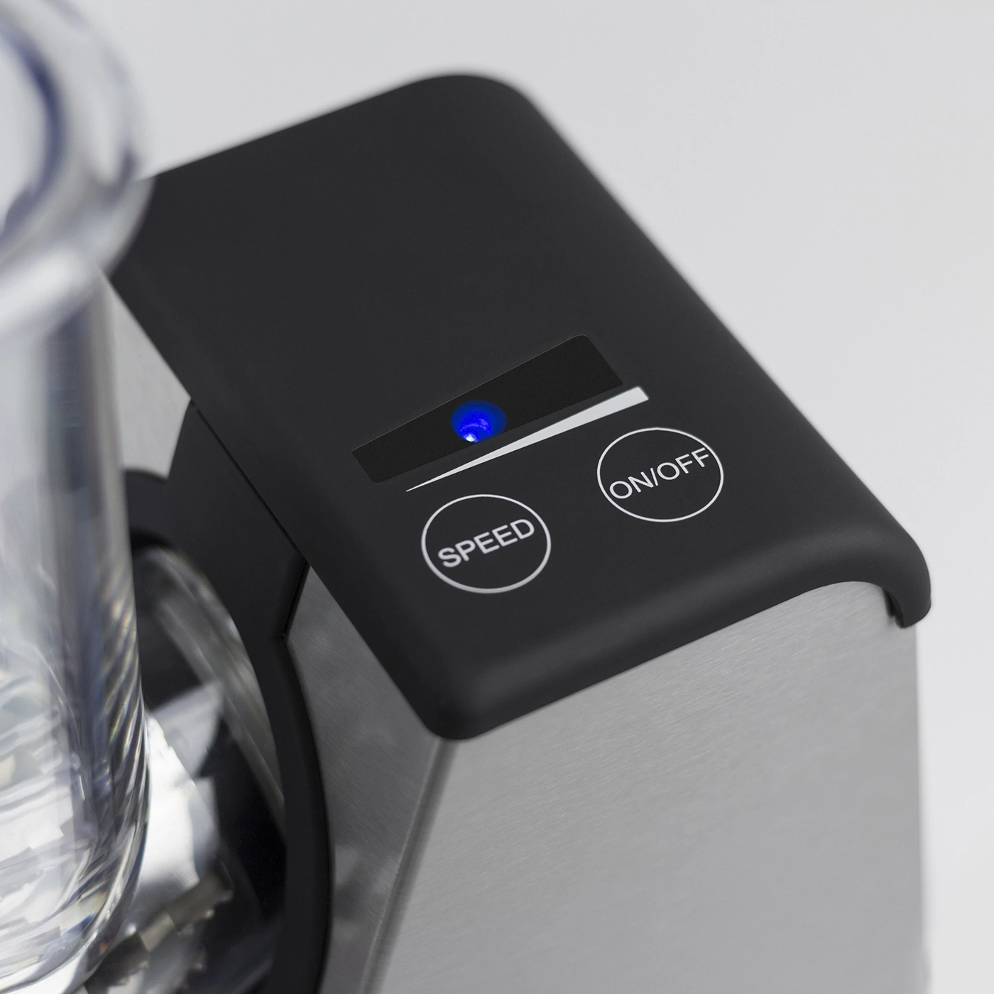 Close-up of a black device with blue light, ON/OFF and SPEED button, stainless steel.