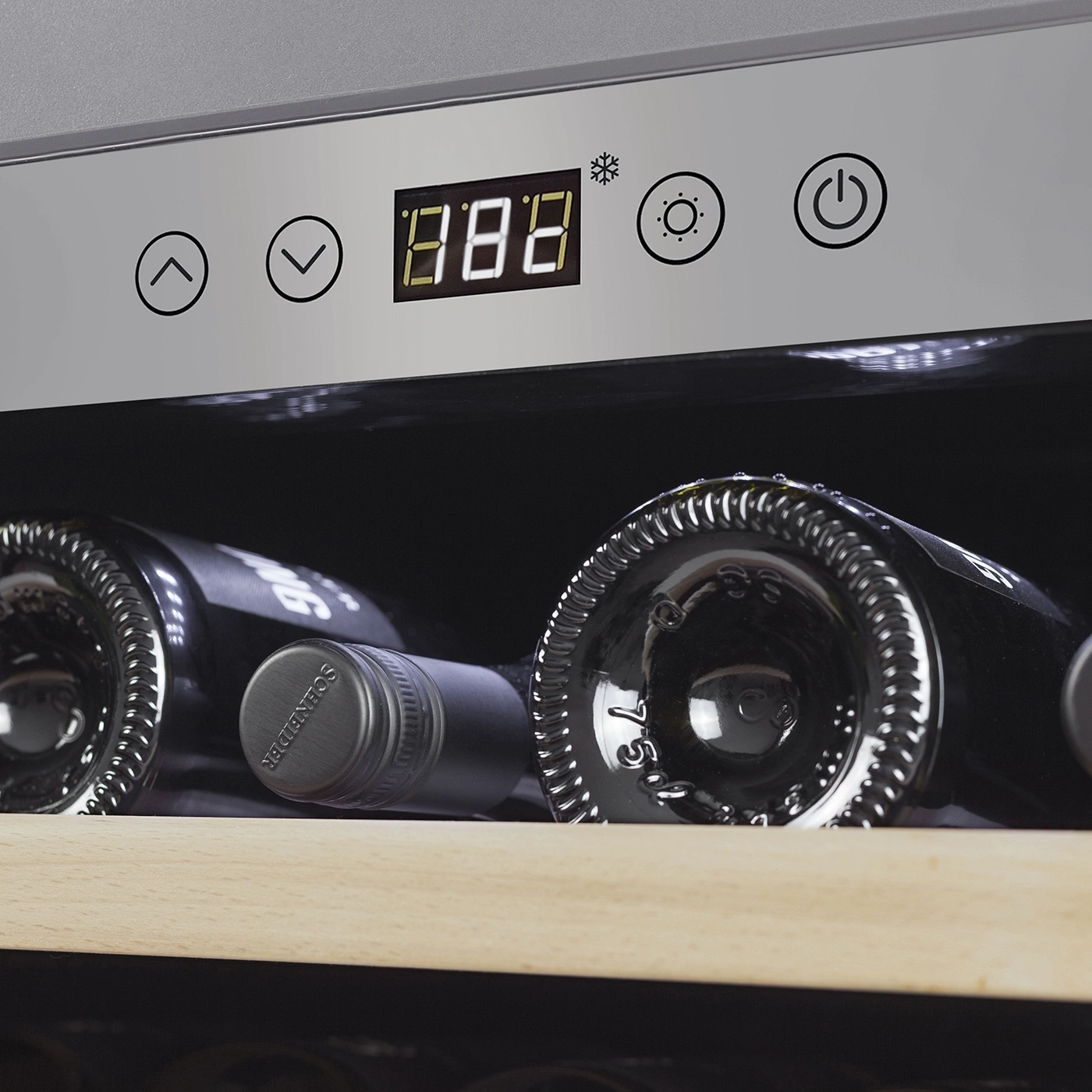 Wine cooler with temperature display and wine bottles inside the fridge.