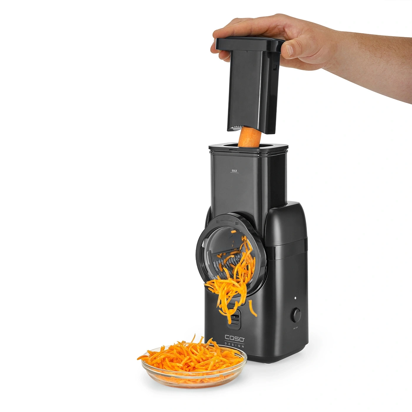 Vegetable slicer with carrot and shredded carrots in a bowl