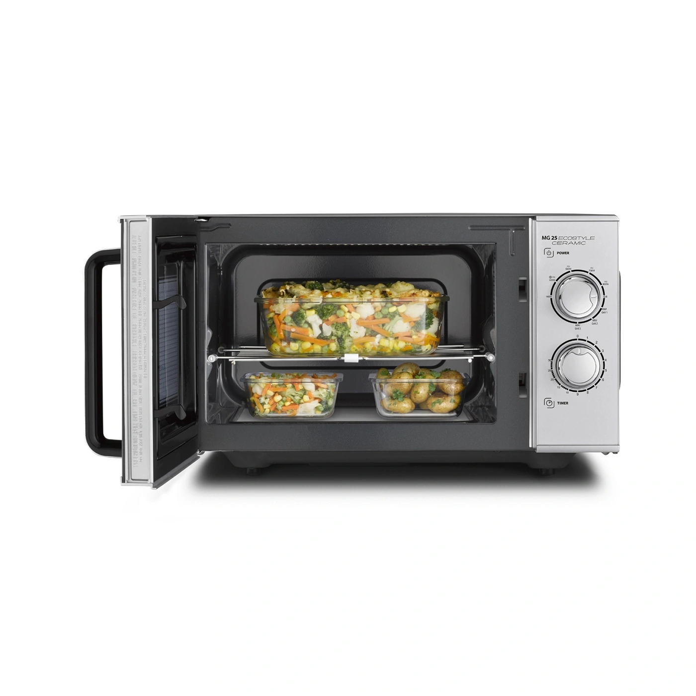 Microwave with vegetables inside, open, ready to cook, interior view
