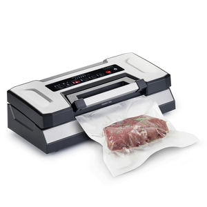 Vacuum sealer with meat in a bag, ready for vacuum sealing process.