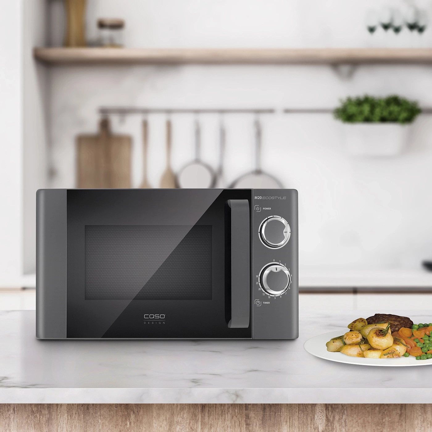 Microwave on a kitchen countertop with food on a plate