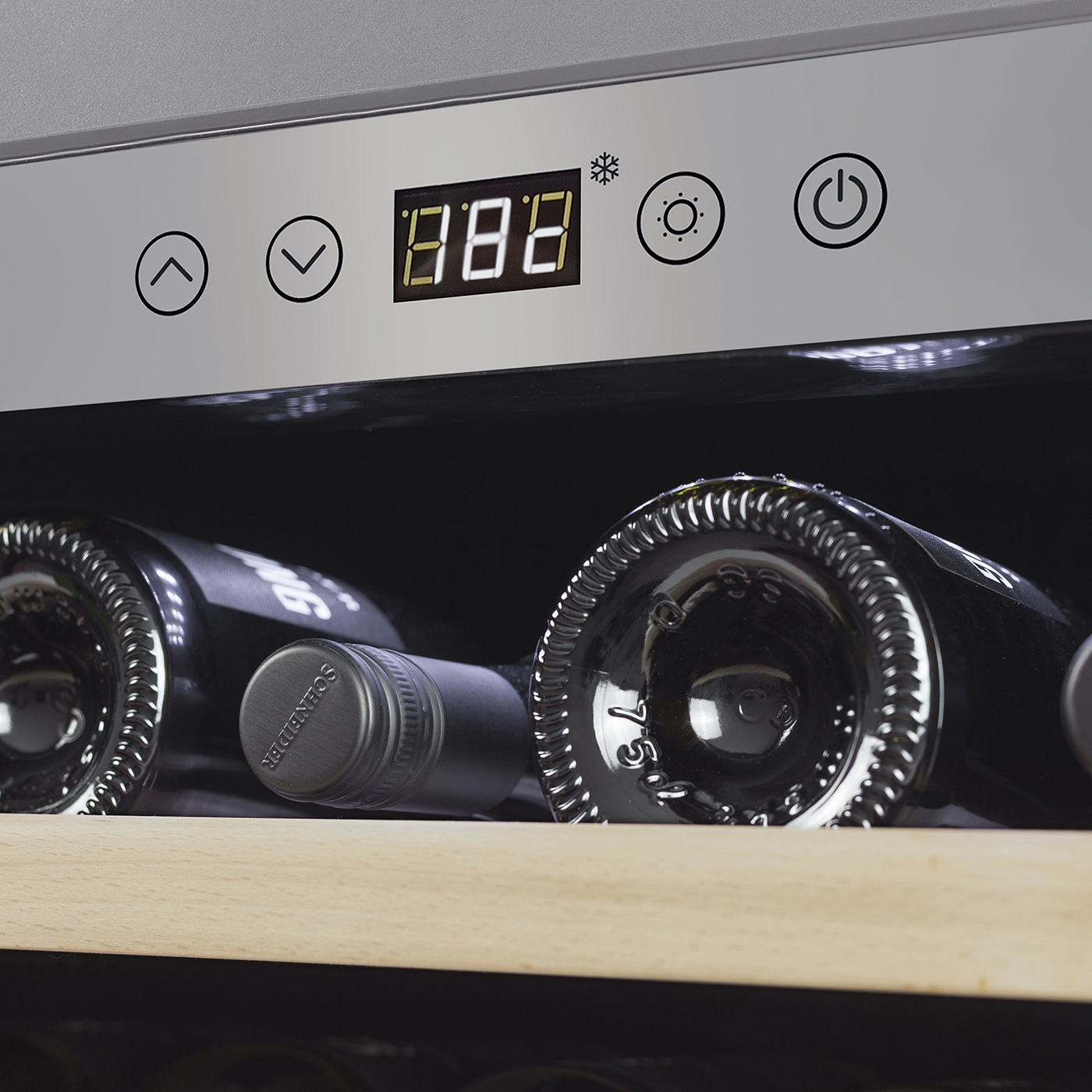 Wine cooler with temperature display and wine bottles inside the fridge.
