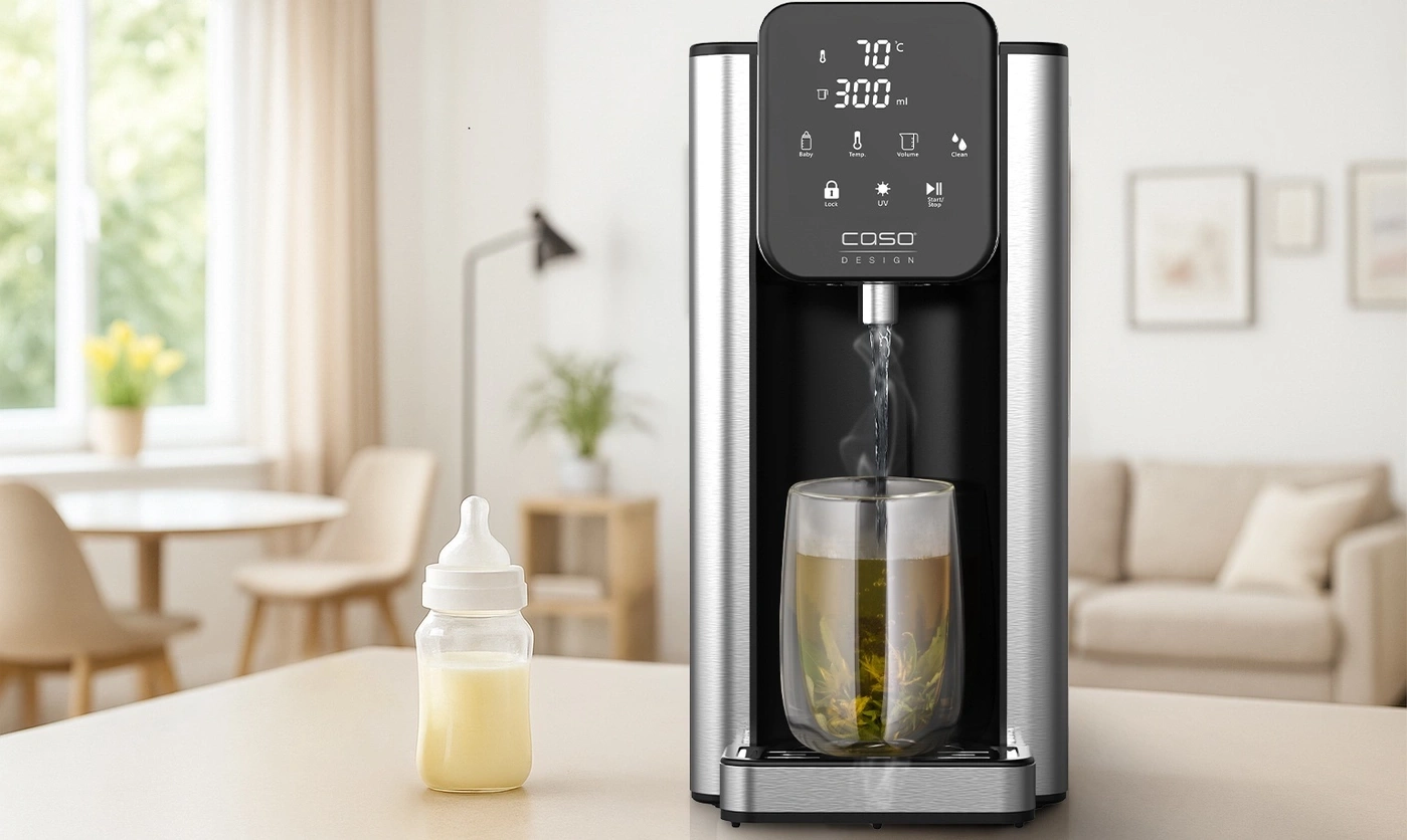 A water dispenser with a digital display and a glass of tea next to it.