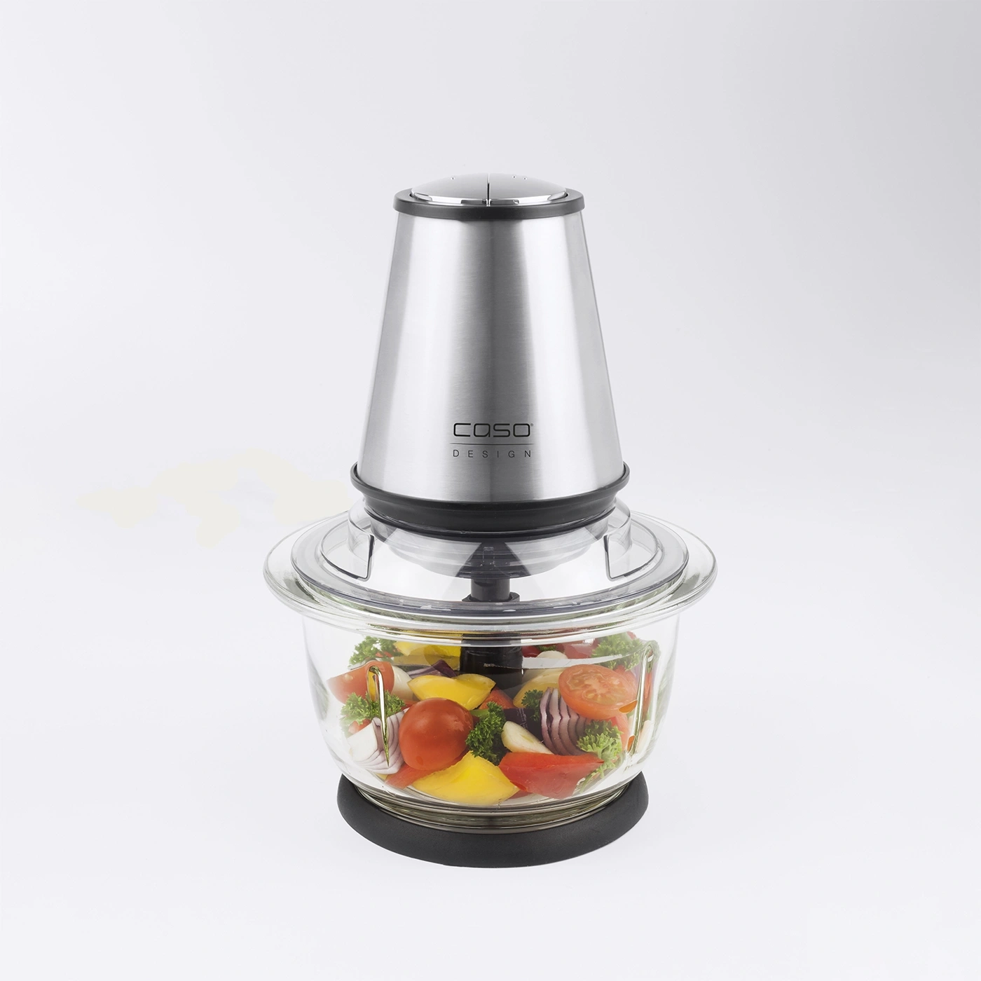 Food processor with vegetables in a glass container, isolated on white background