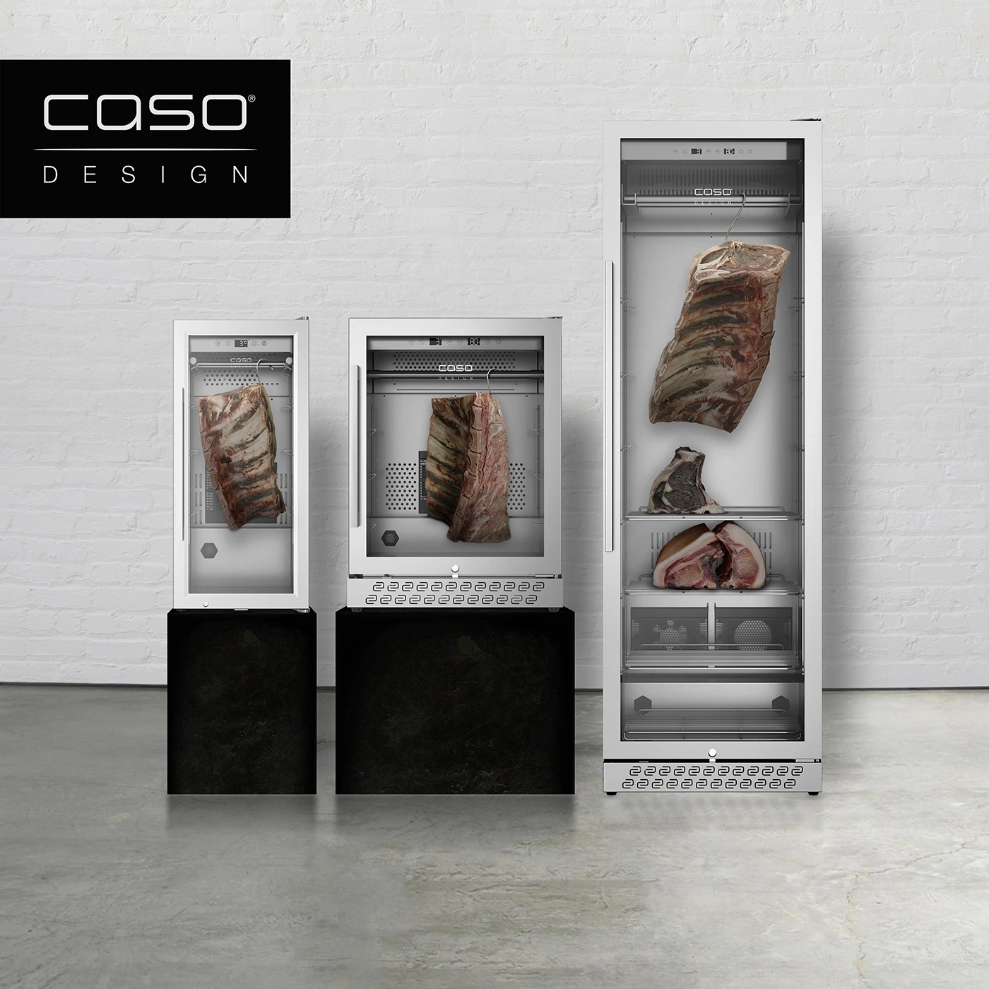 Three Caso Design aging refrigerators with meat inside on a concrete floor.