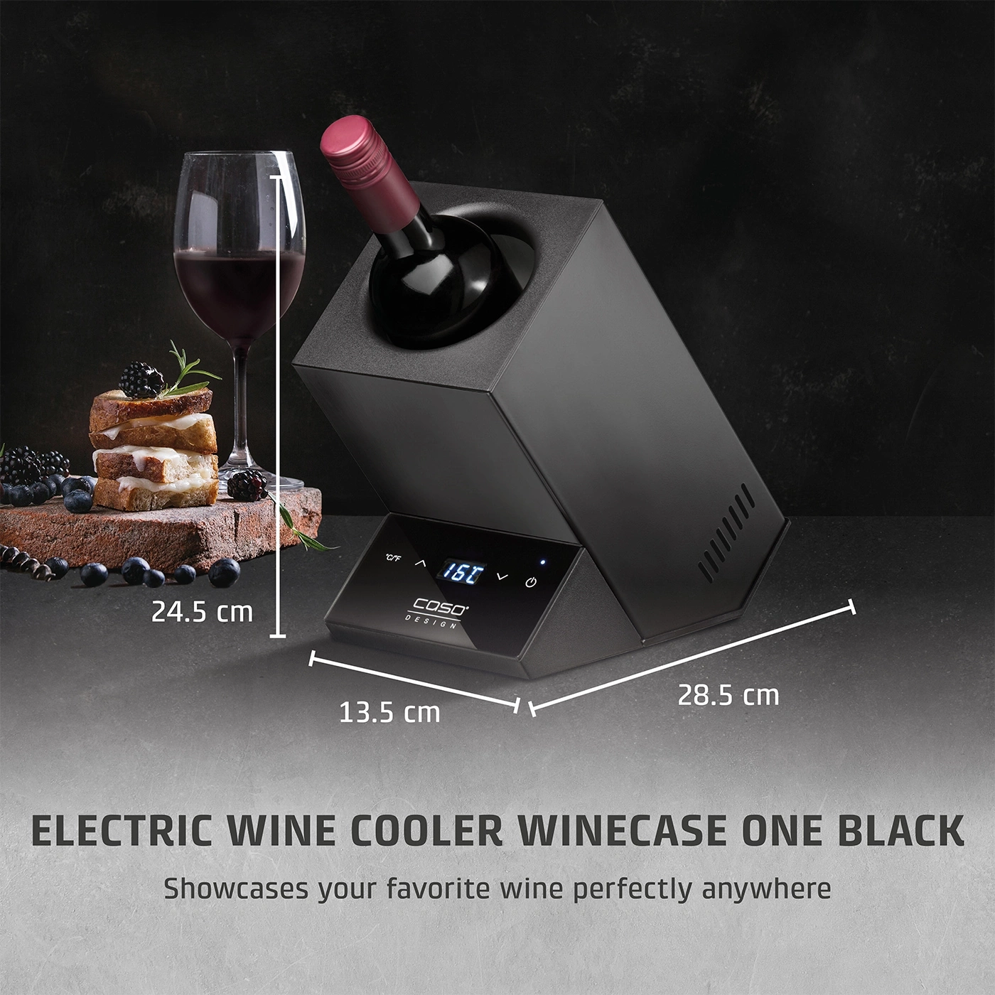 Wine cooler with wine, glass and food. Dimensions: 24.5 cm, 13.5 cm, 28.5 cm. Black design.