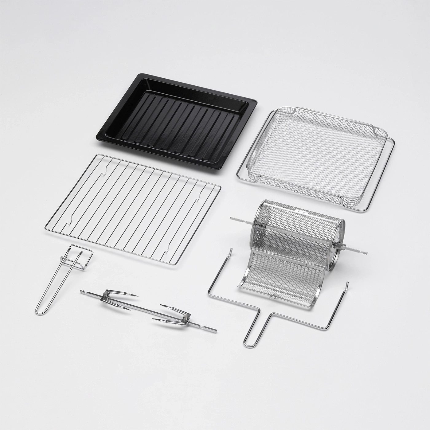 Oven accessories including a baking tray, grill rack, and rotisserie parts.