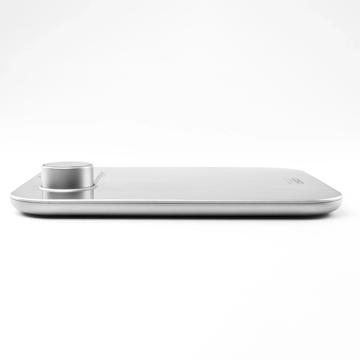Silver scale with round knob, minimalist design, isolated on white background