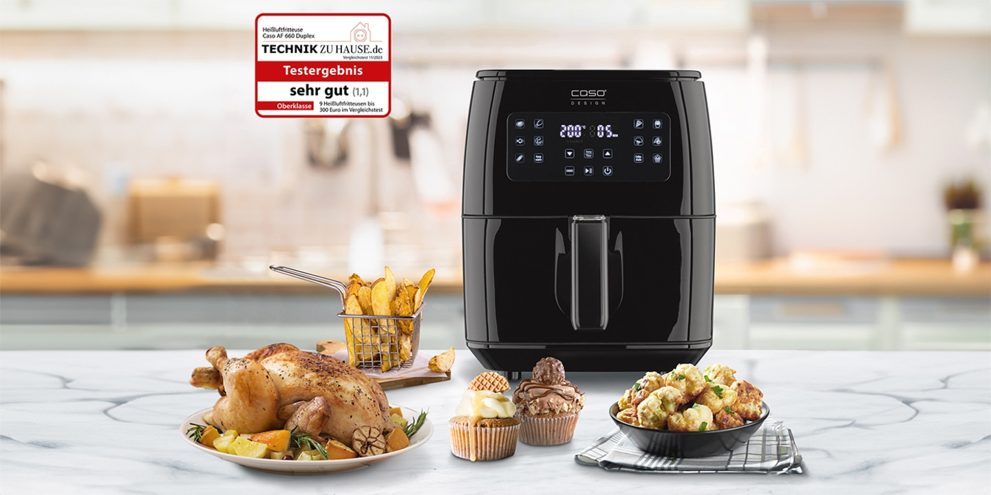 Black air fryer with food. Test result: very good. Top class. Caso AF 660 Duplex.