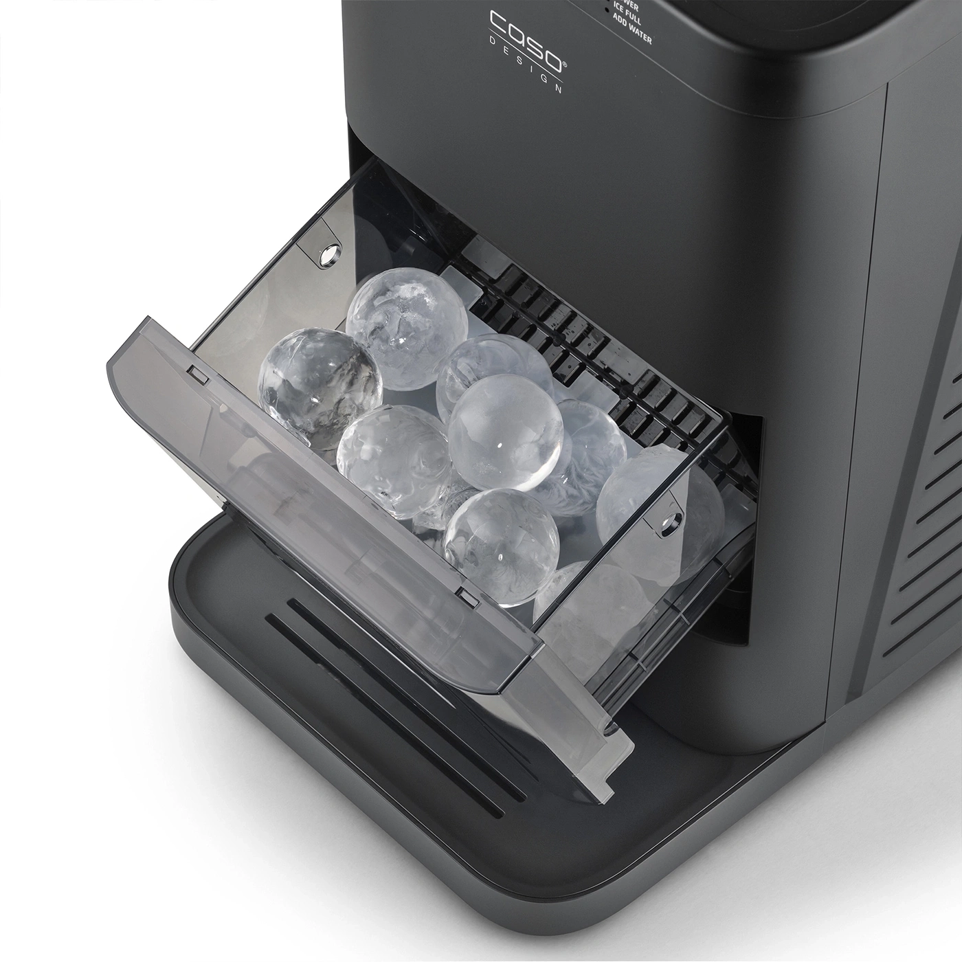 Ice cube tray with round ice cubes in an ice maker