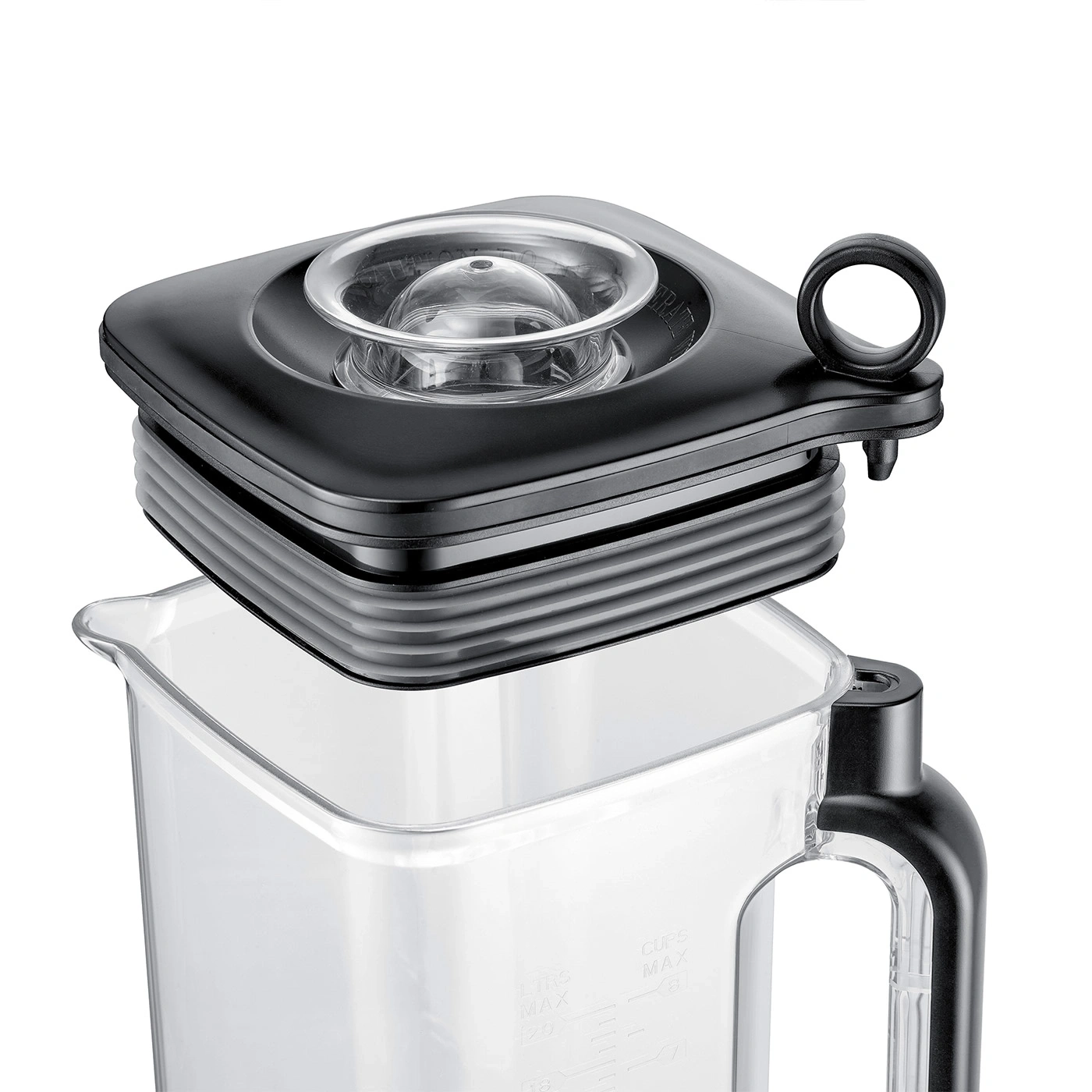 A close-up image of a black lid over a transparent blender pitcher.