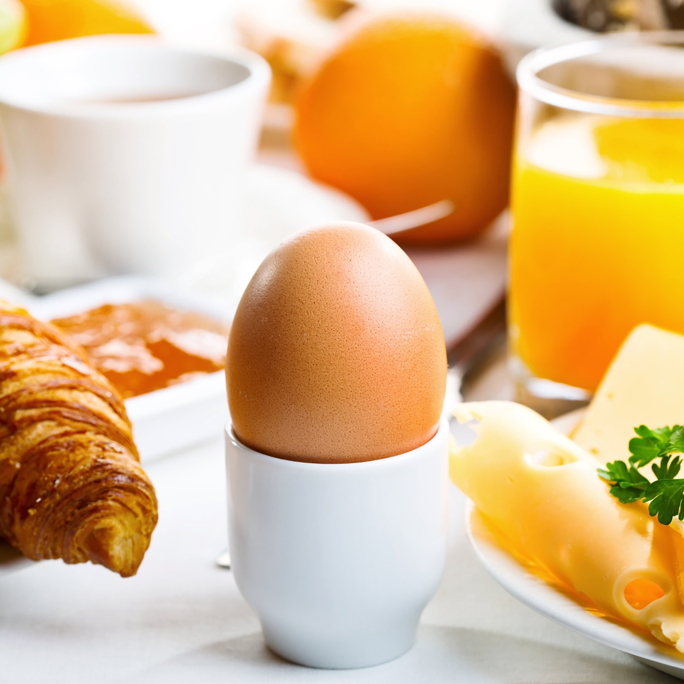 Breakfast with egg, croissant, cheese, juice and coffee. A delicious start to the day.