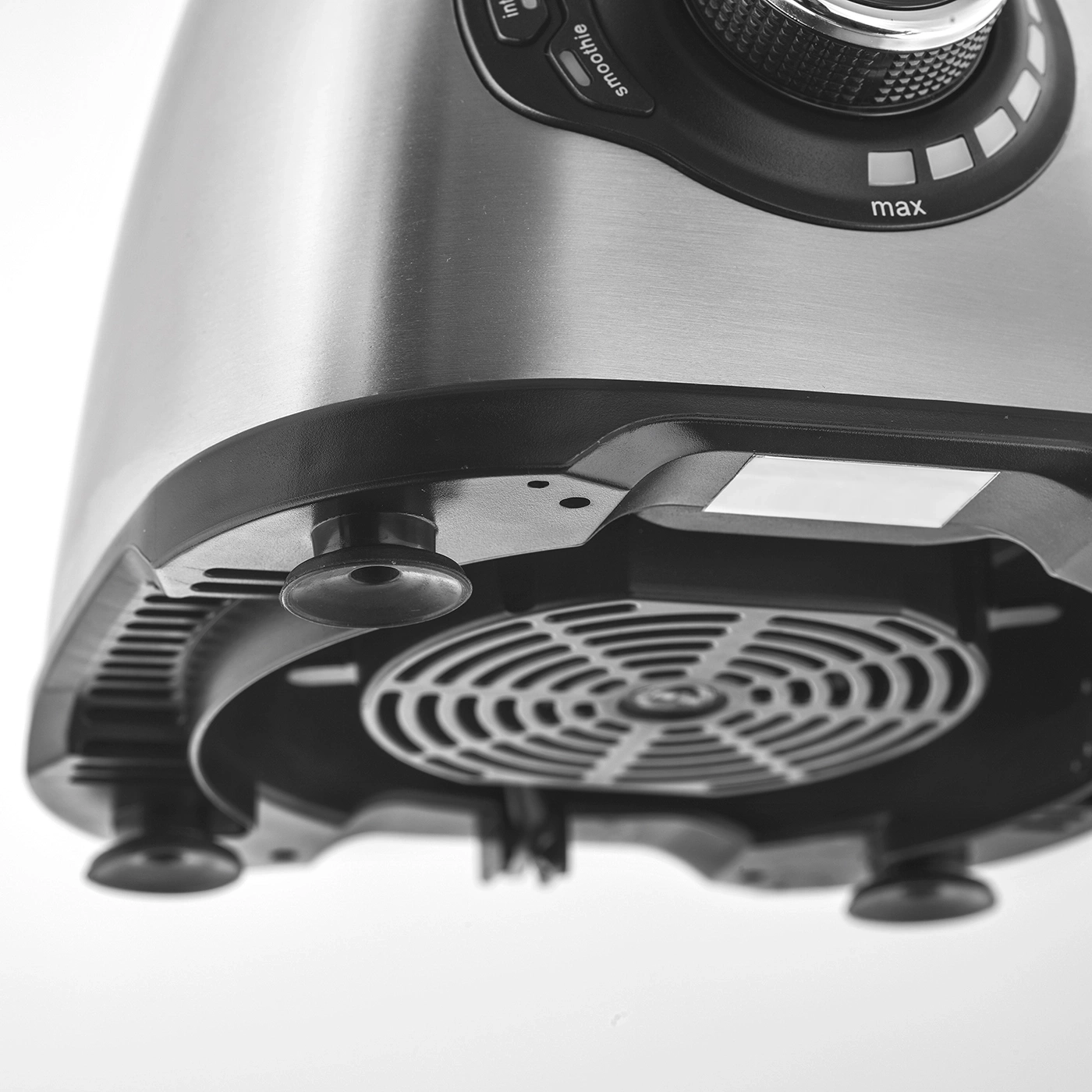 Close-up of a silver blender with a black base and control panel, max setting.