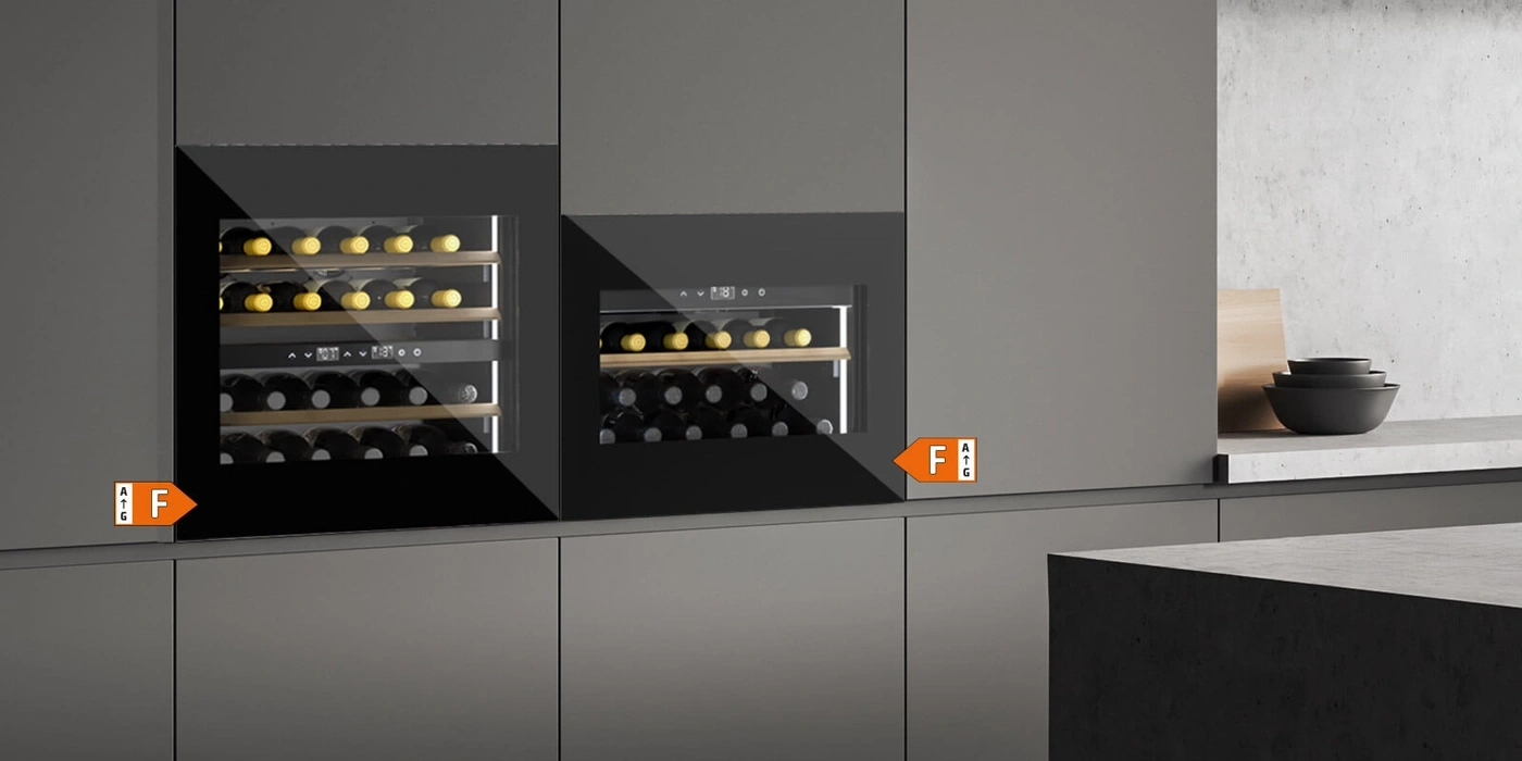 Two built-in wine coolers with F energy efficiency rating on kitchen cabinets.