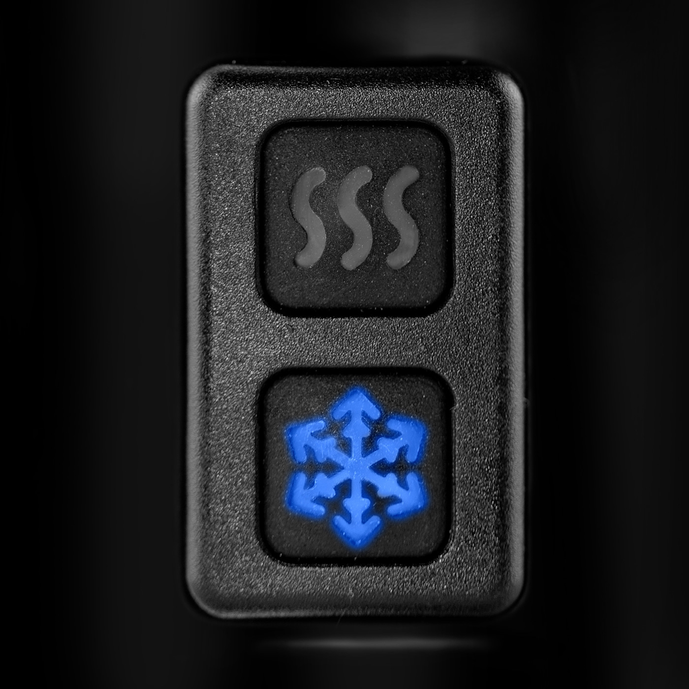 Black button with heat and cool symbols, illuminated in blue.