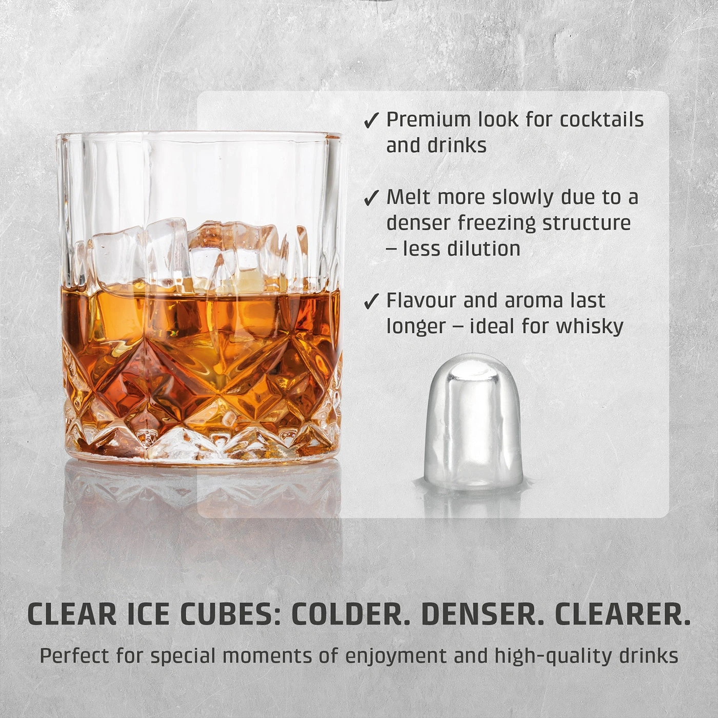 A glass of whiskey with ice cubes and a single ice cube next to it.