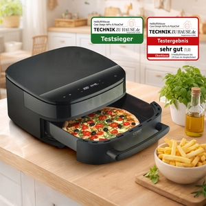 Air fryer with pizza and fries on a kitchen counter.