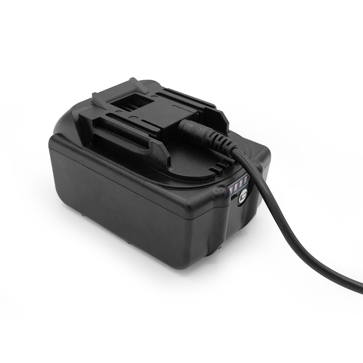 Black battery with cable connected to a charger on a white background.