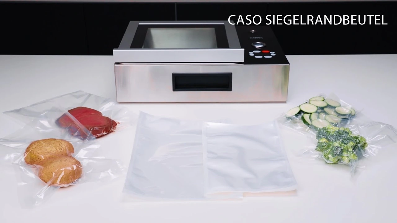 Vacuum sealer with vegetables and meat in bags on a white table