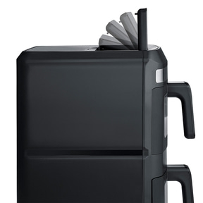 A black kitchen appliance with a flip-up lid