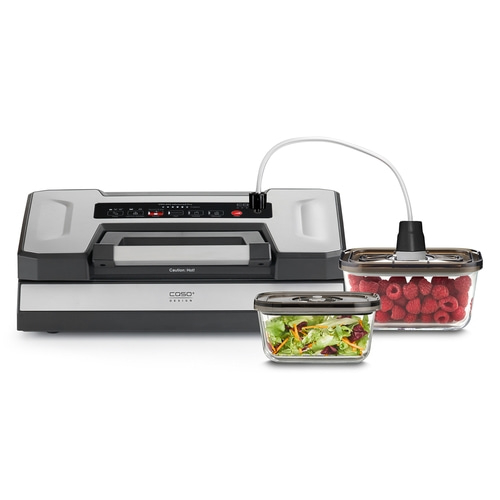 Vacuum sealer with containers filled with raspberries and salad.