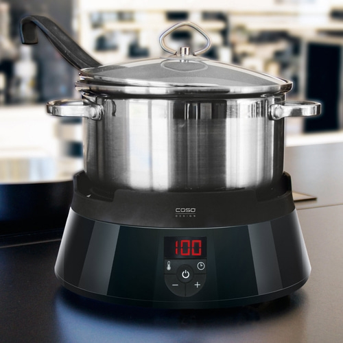 Stainless steel pot on induction cooktop with digital display and control elements