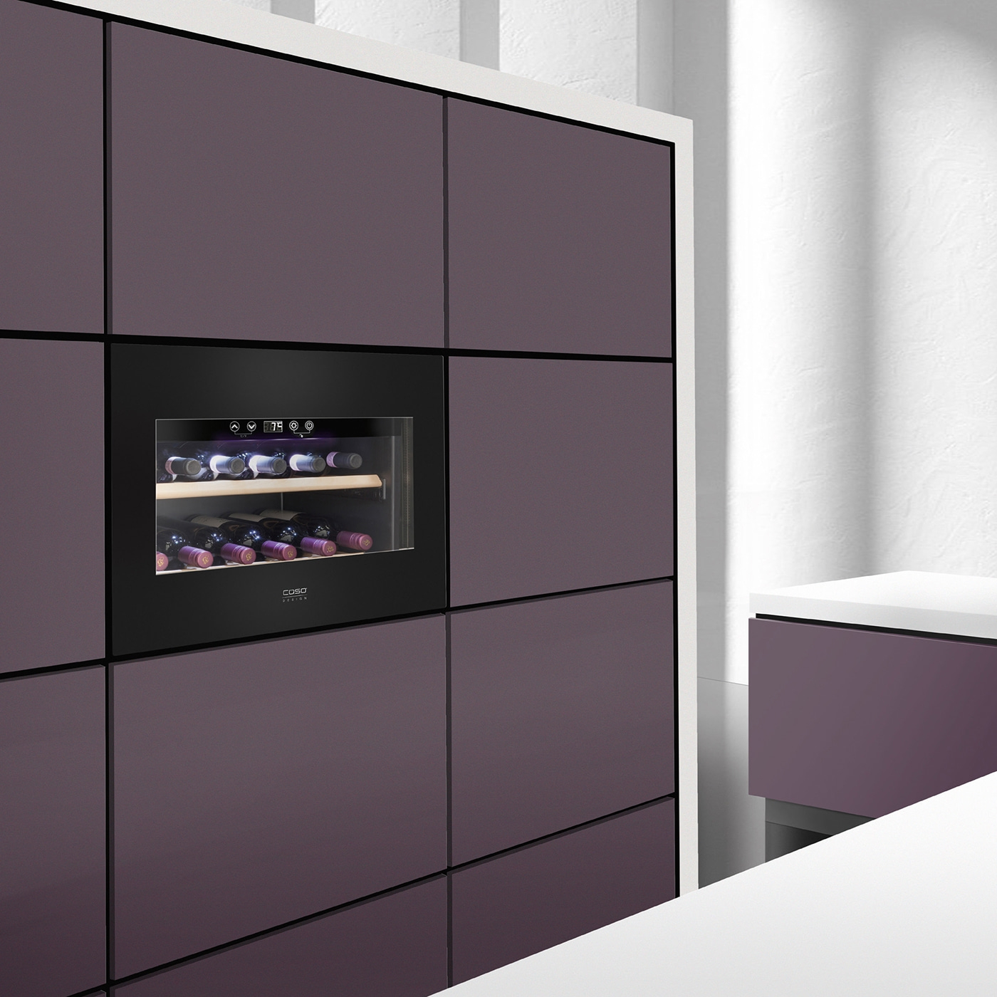 Wine cooler in modern kitchen with dark cabinets and wine bottles