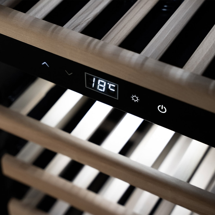 Wine cooler with temperature display and control panel, wooden shelves in the foreground