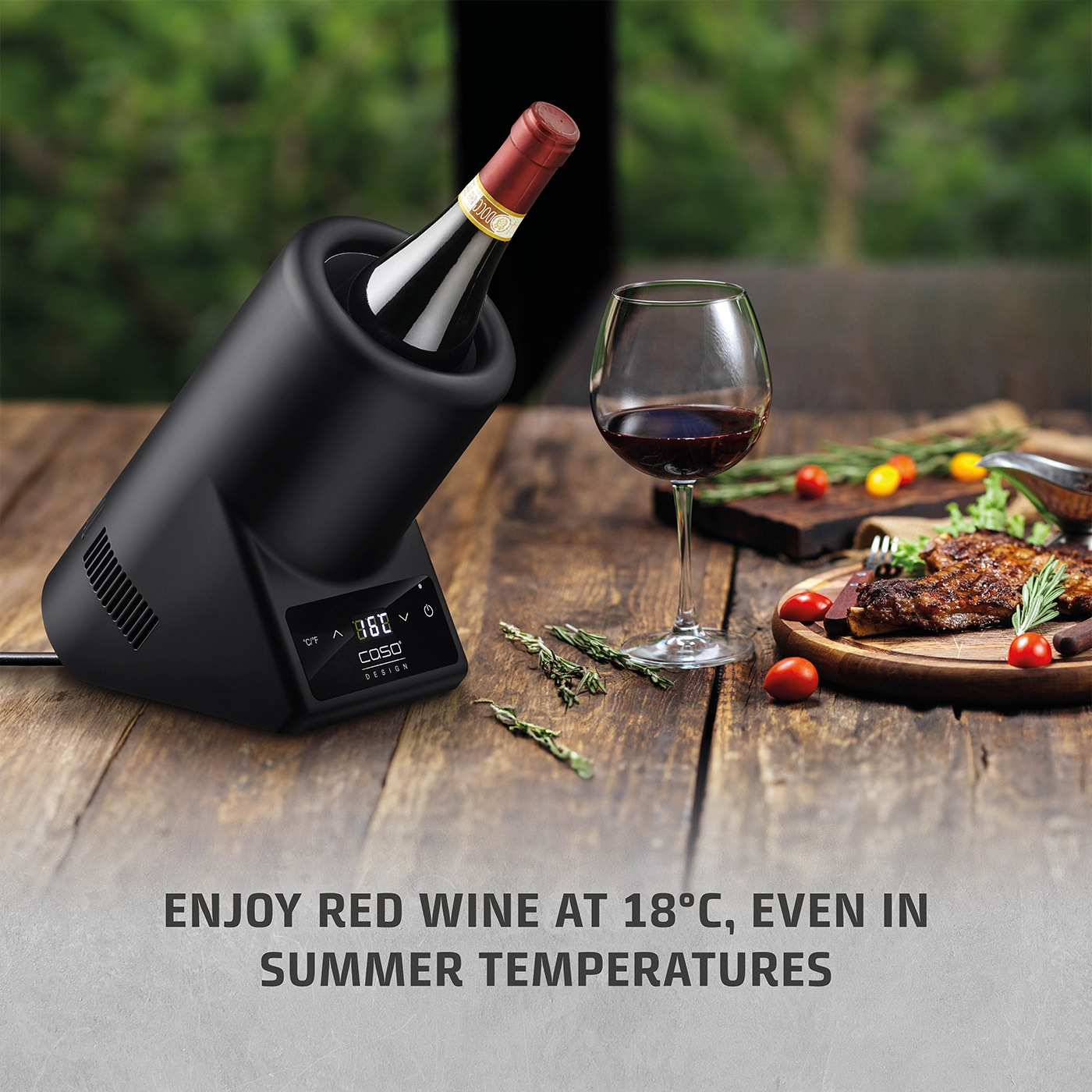 Red wine cooler with glass and food on a wooden table, summer enjoyment.