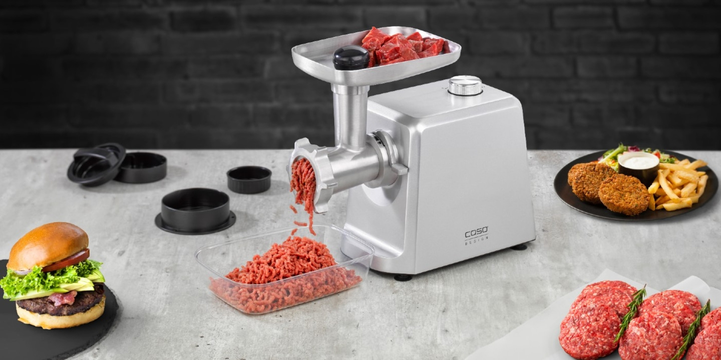 Meat grinder with burger and fries. Preparing food.