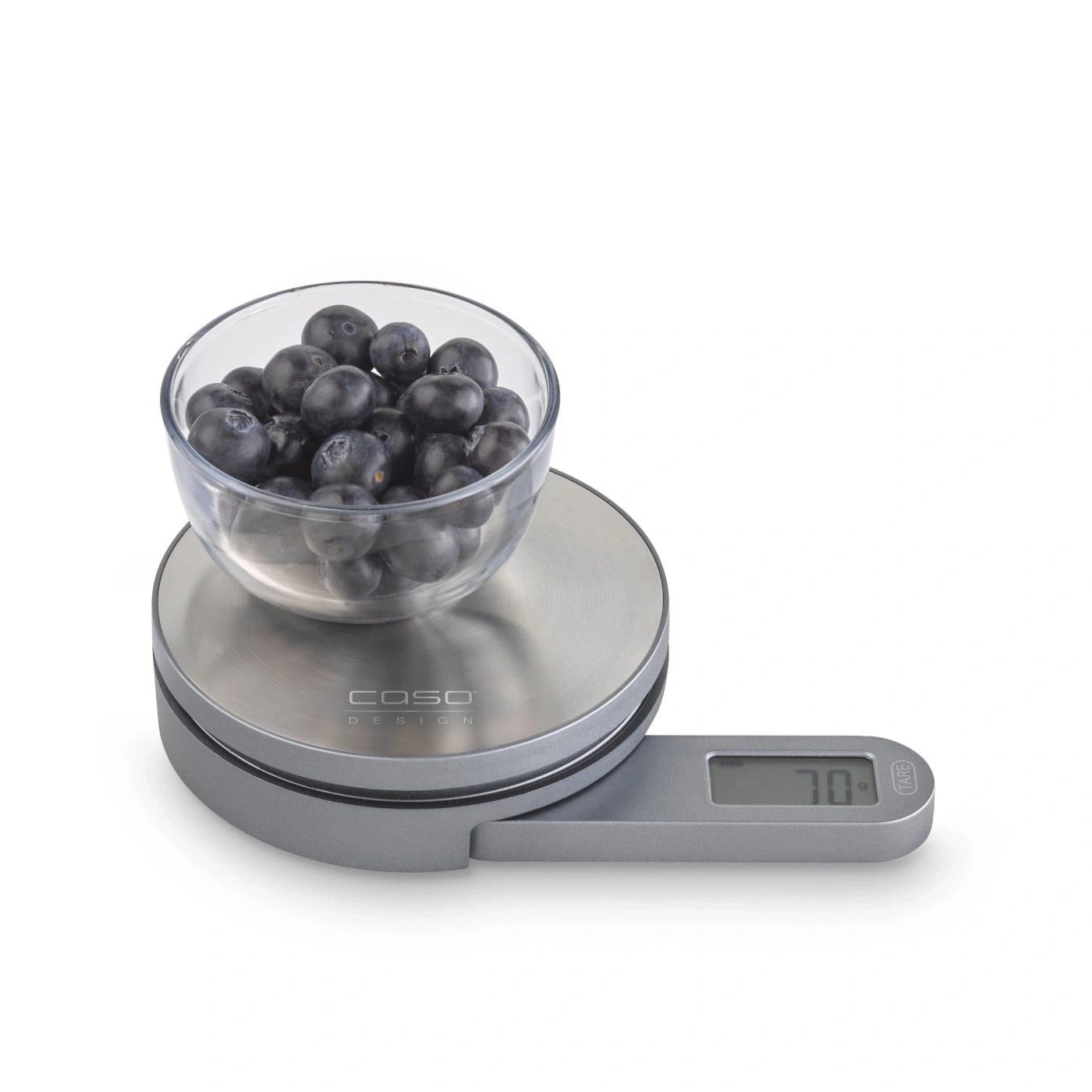 Blaubeeren in einer Glasschüssel auf einer Küchenwaage, 70g Gewicht.