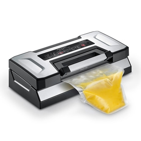 Vacuum sealer with yellow contents in a bag, ready to be sealed for preservation.